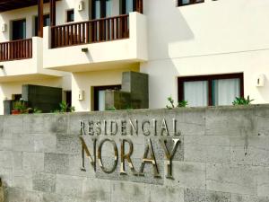 a sign for residential norway in front of a building at Casa Zen in Puerto Calero