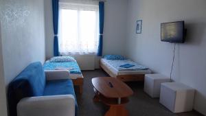 A bed or beds in a room at Apartmány Sluníčko