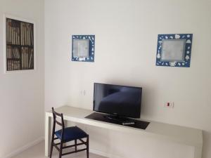 TV a/nebo společenská místnost v ubytování Domus Municipio