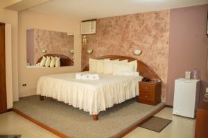 Кровать или кровати в номере Hotel Villa Rita Chiclayo