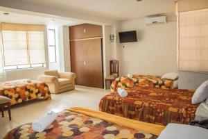 
Cama o camas de una habitación en Hotel Villa Rita Chiclayo
