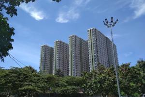 a tall building with a street light in front of it at Scandinavian Asia Afrika in Bandung