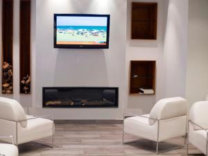 TV a/nebo společenská místnost v ubytování Hotel La Sèquia Molinar
