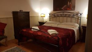 Cama ou camas em um quarto em Villa Barone