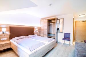 Postel nebo postele na pokoji v ubytování Hotel Sonnenheim