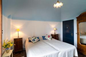 A bed or beds in a room at Locanda Casanuova