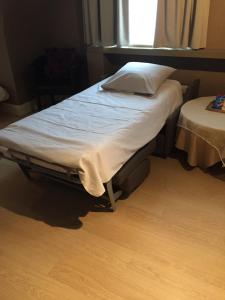Postel nebo postele na pokoji v ubytování Hotel Prélude