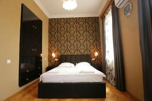Кровать или кровати в номере Guest House Pirosmani 60