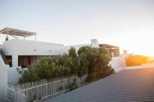 a building with a bunch of stairs in front of it at Sugar Shack in Paternoster