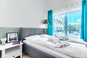 Posteľ alebo postele v izbe v ubytovaní Apartamenty AmberHome