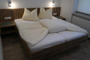 Łóżko lub łóżka w pokoju w obiekcie Apart Felsenhof
