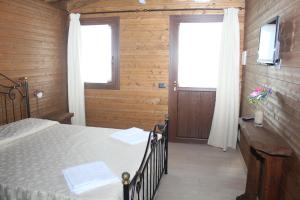 Posteľ alebo postele v izbe v ubytovaní Villaggio San Demetrio