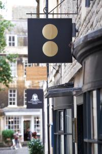 a sign hanging on the side of a building at Eight in Bath