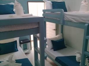 Postel nebo postele na pokoji v ubytování Laule'a Hostel