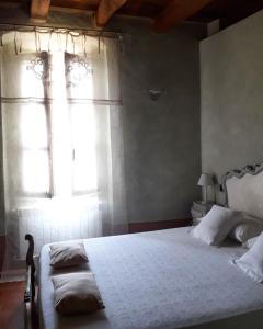 En eller flere senge i et værelse på Piccola Corte Antica