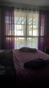 Ένα ή περισσότερα κρεβάτια σε δωμάτιο στο Casa do Sossego - Guesthouse