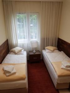 Postel nebo postele na pokoji v ubytování Apartamenty Dom Saski 10 minut od Centrum Warszawy