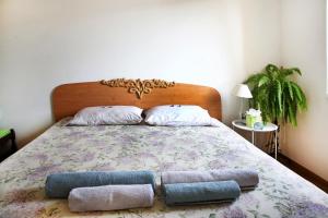 a bedroom with a bed with two pillows on it at Victoria's Place in Varna City