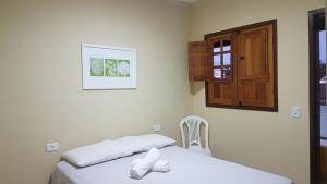 Postel nebo postele na pokoji v ubytování Sol Hostel & Pousada Maragogi