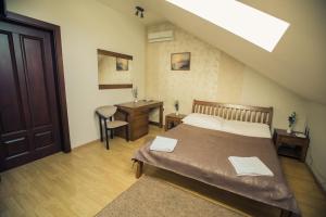 Postel nebo postele na pokoji v ubytování Premiere Hotel