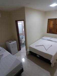 Postel nebo postele na pokoji v ubytování Sol Hostel & Pousada Maragogi