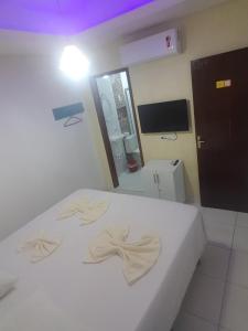 Postel nebo postele na pokoji v ubytování Sol Hostel & Pousada Maragogi