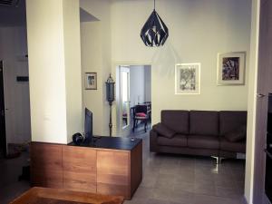 a living room with a couch and a tv at Casa Buccari in Venice