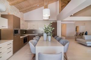 A kitchen or kitchenette at Porto Vasilikos Villas
