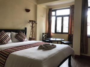Ένα ή περισσότερα κρεβάτια σε δωμάτιο στο Hotel Yala Peak