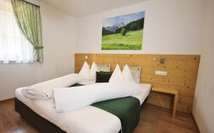 Postel nebo postele na pokoji v ubytování Residenz Erschbaum