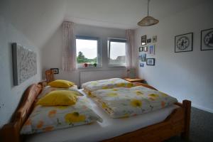 Llit o llits en una habitació de Ferienhaus Scholien