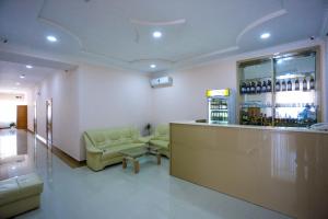 a bar with couches and a counter in a room at Canyon Hotel in Martvili