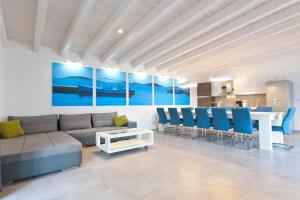 a living room with a couch and a table and chairs at Wellness & Spa, Villa STELLA - heated pool, facilities for children, close to beaches and the sea, Medulin - Istria in Pomer