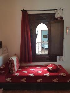Postel nebo postele na pokoji v ubytování Dar Manara - Medina d'Asilah
