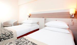 Posteľ alebo postele v izbe v ubytovaní Comfort by Trio