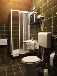 a bathroom with a toilet and a sink at Turistična kmetija Žerovc in Bled