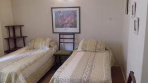 Postel nebo postele na pokoji v ubytování Departamento Belgrano