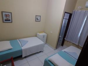 Postel nebo postele na pokoji v ubytování Sol Hostel & Pousada Maragogi