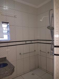 a bathroom with a shower and a sink at Motel Morumbi (Adults Only) in Taboão da Serra +53 photos