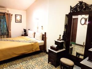 Letto o letti in una camera di nDalem Gamelan