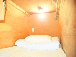 Postel nebo postele na pokoji v ubytování Hiroshima Hostel EN