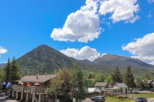 a view of a town with mountains in the background at Condo Right On Main Street By Daniel in Frisco