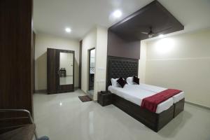 Krevet ili kreveti u jedinici u objektu Shivalaya Residency