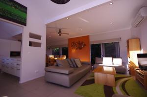 a living room with a couch and a table at Cadence at Bright - Luxury accommodation in Bright