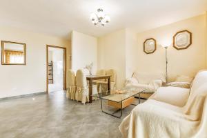 Ένα ή περισσότερα κρεβάτια σε δωμάτιο στο Jardines Canarios