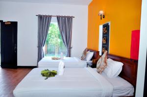 Lova arba lovos apgyvendinimo įstaigoje Vimean Sovannaphoum Resort