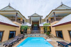 an exterior view of a house with a swimming pool at Haadson Resort & Koh Raham in Haad Son
