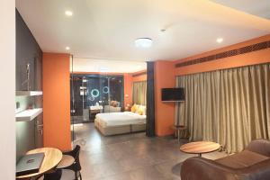 Кровать или кровати в номере Fahrenheit Hotels & Resorts