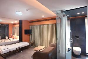 Кровать или кровати в номере Fahrenheit Hotels & Resorts