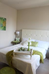 Postel nebo postele na pokoji v ubytování Apart-Hotel la Rocchetta